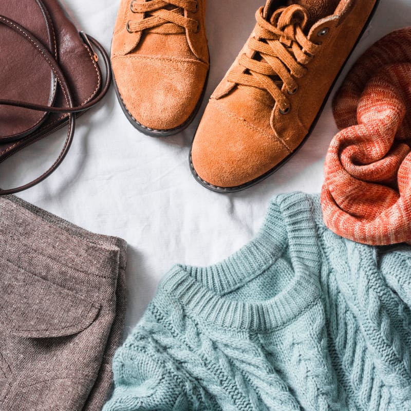 lake-crest-village-fall-shopping Fall sweaters and shoes arranged for seasonal shopping